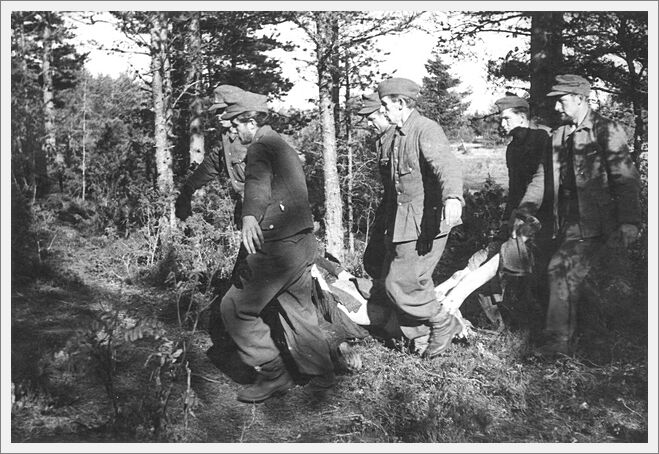 Klooga, Estonia, September 1945, German prisoners removing a scorched corpse